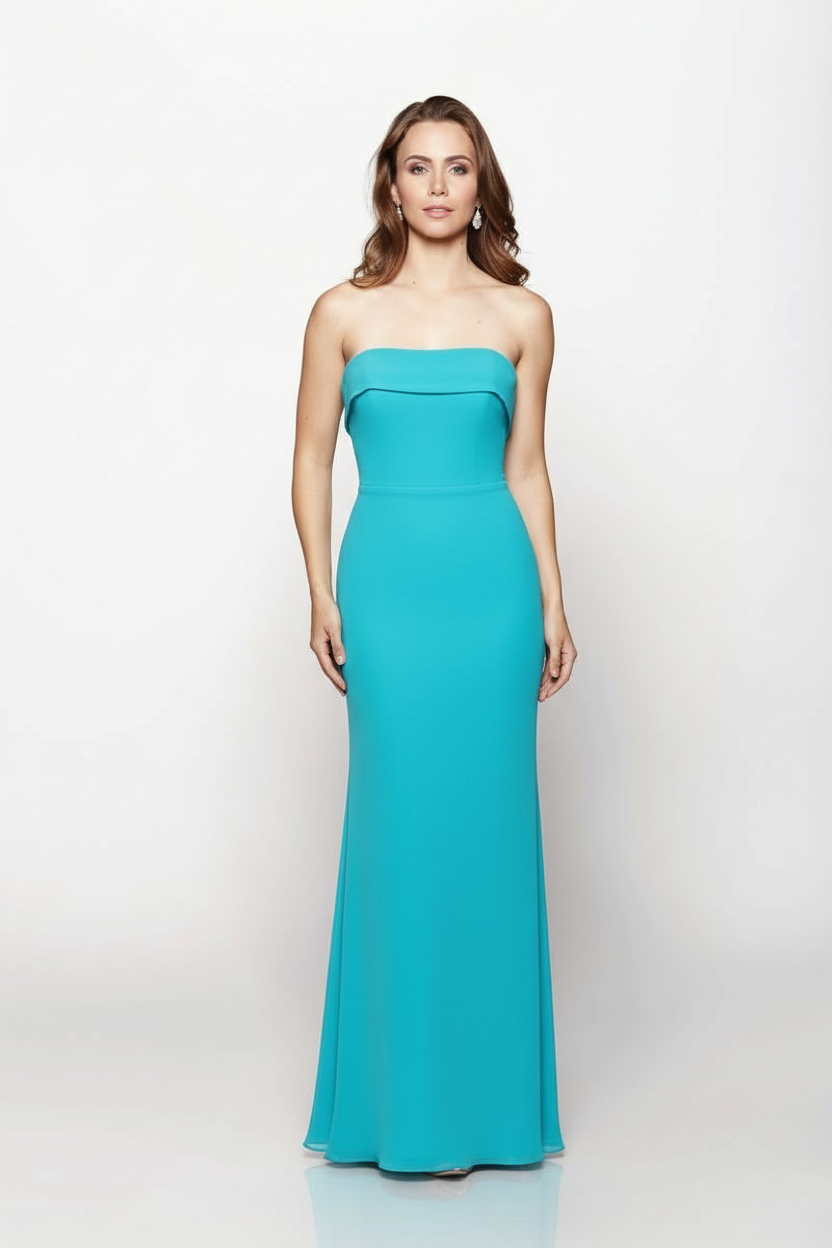 Woman wearing a strapless teal gown on a white background